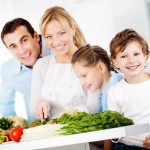 Happy family are preparing a healthy dinner at home.